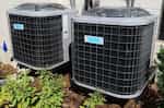Two outdoor air conditioning units side by side