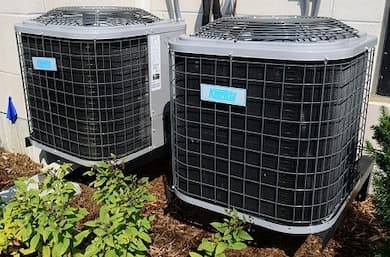 Two outdoor air conditioning units side by side